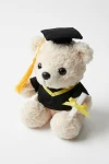 Studenterbamse i sort toga med gul kvast på studenterhuen